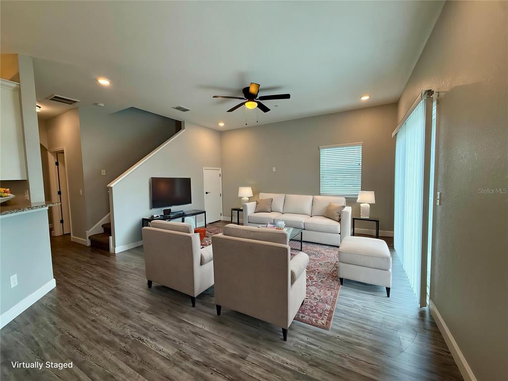 2783 Sycamore Street Winter Haven, FL 33881 - Photo 2 of 32 a living room with furniture and a flat screen tv