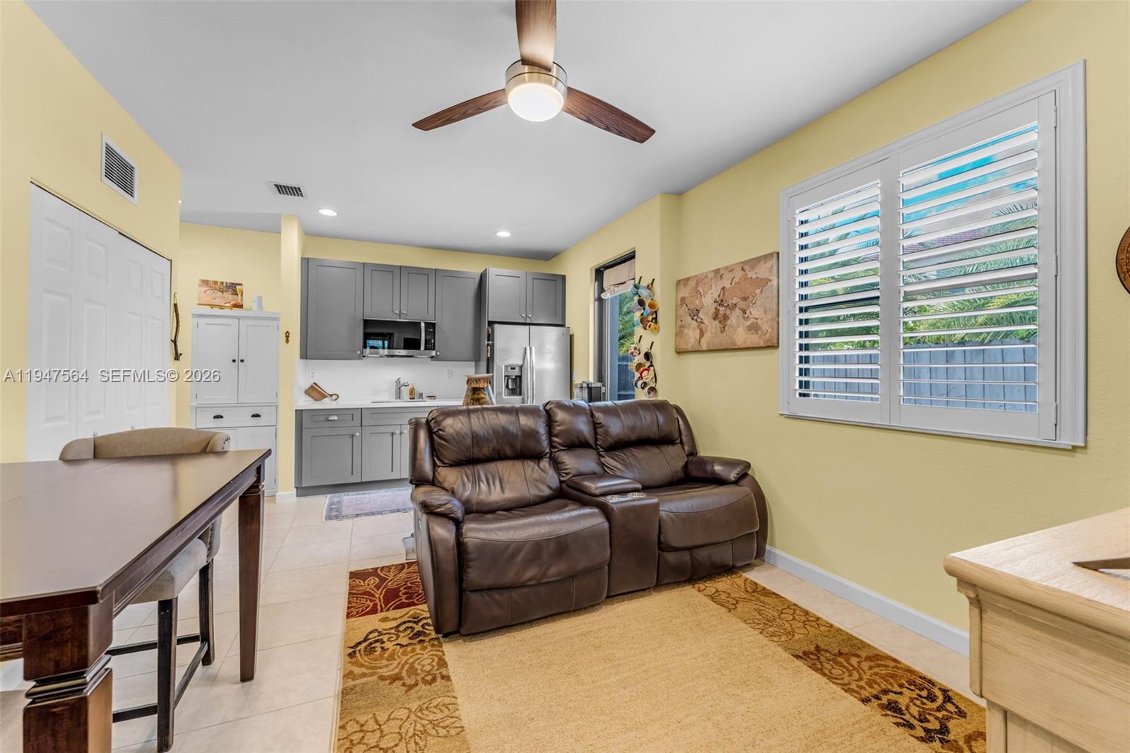 17475 Southwest 153rd Avenue Miami, FL 33187 - Photo 16 of 46 a living room with furniture and a window