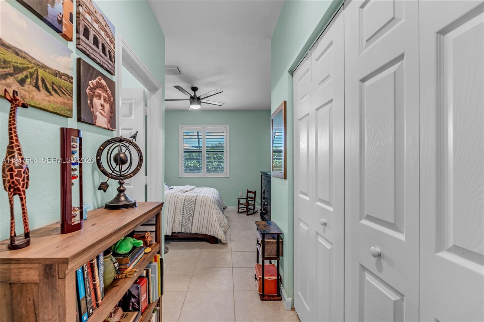 17475 Southwest 153rd Avenue Miami, FL 33187 - Photo 17 of 46 a view of an entryway with furniture and toys