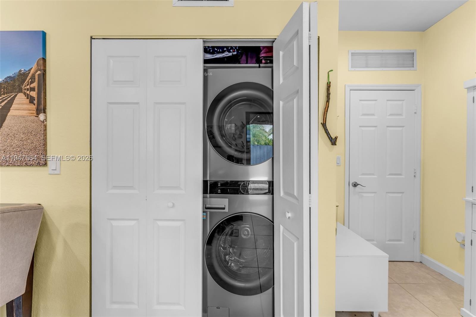17475 Southwest 153rd Avenue Miami, FL 33187 - Photo 20 of 46 a utility room with dryer and washer