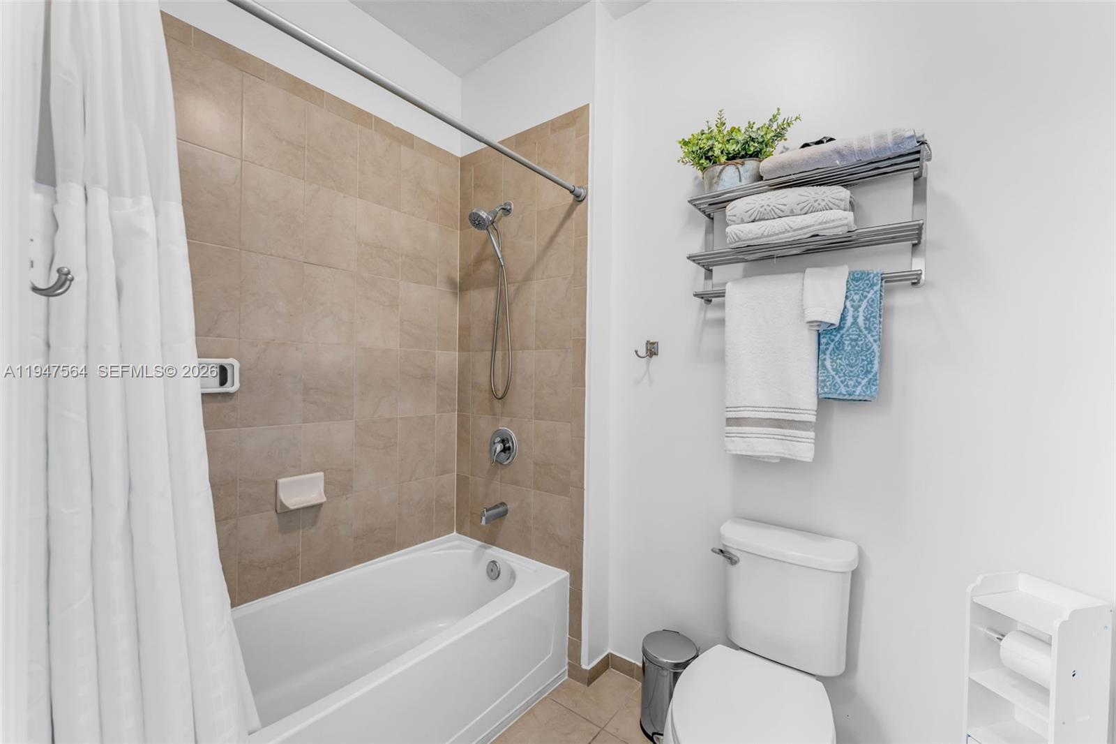 17475 Southwest 153rd Avenue Miami, FL 33187 - Photo 29 of 46 a bathroom with a shower a toilet and a bathtub