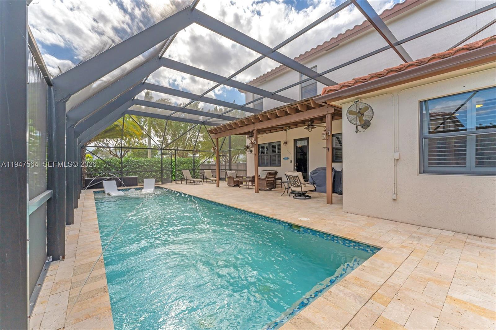 17475 Southwest 153rd Avenue Miami, FL 33187 - Photo 3 of 46 a view of swimming pool with a patio