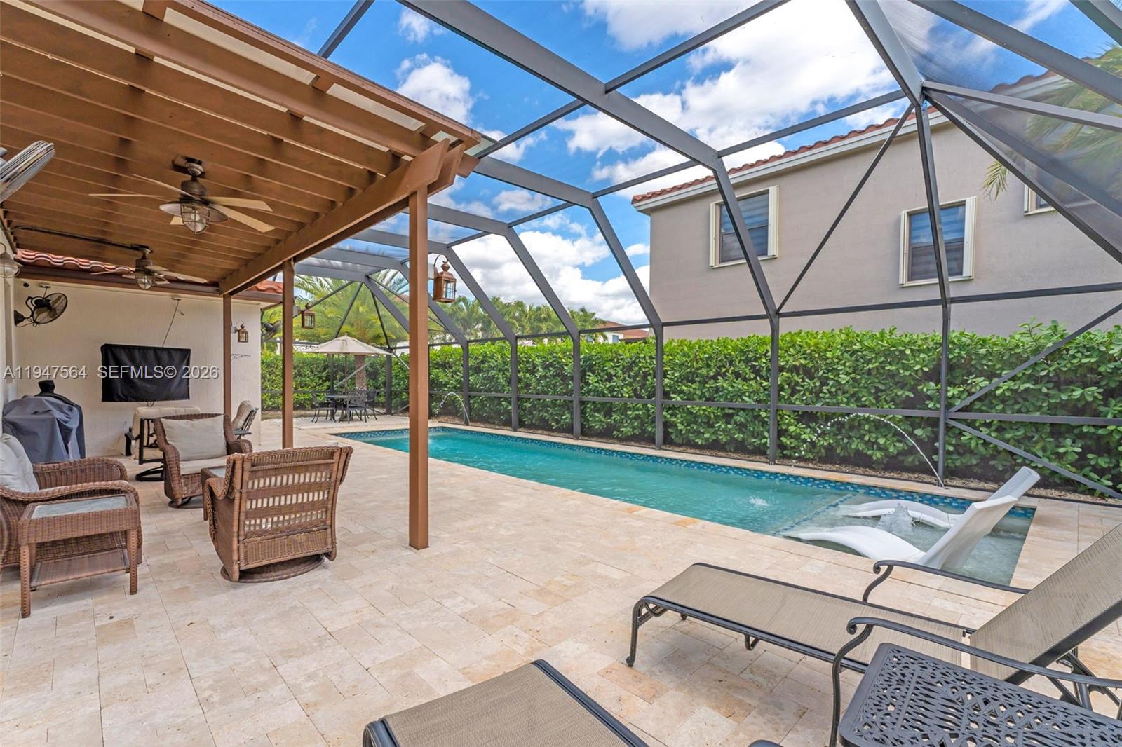17475 Southwest 153rd Avenue Miami, FL 33187 - Photo 34 of 46 a view of patio with a table and chairs under an umbrella
