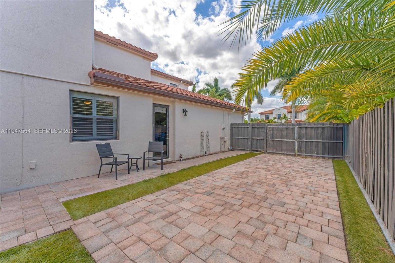 17475 Southwest 153rd Avenue Miami, FL 33187 - Photo 37 of 46 a view of backyard with a patio and a garden