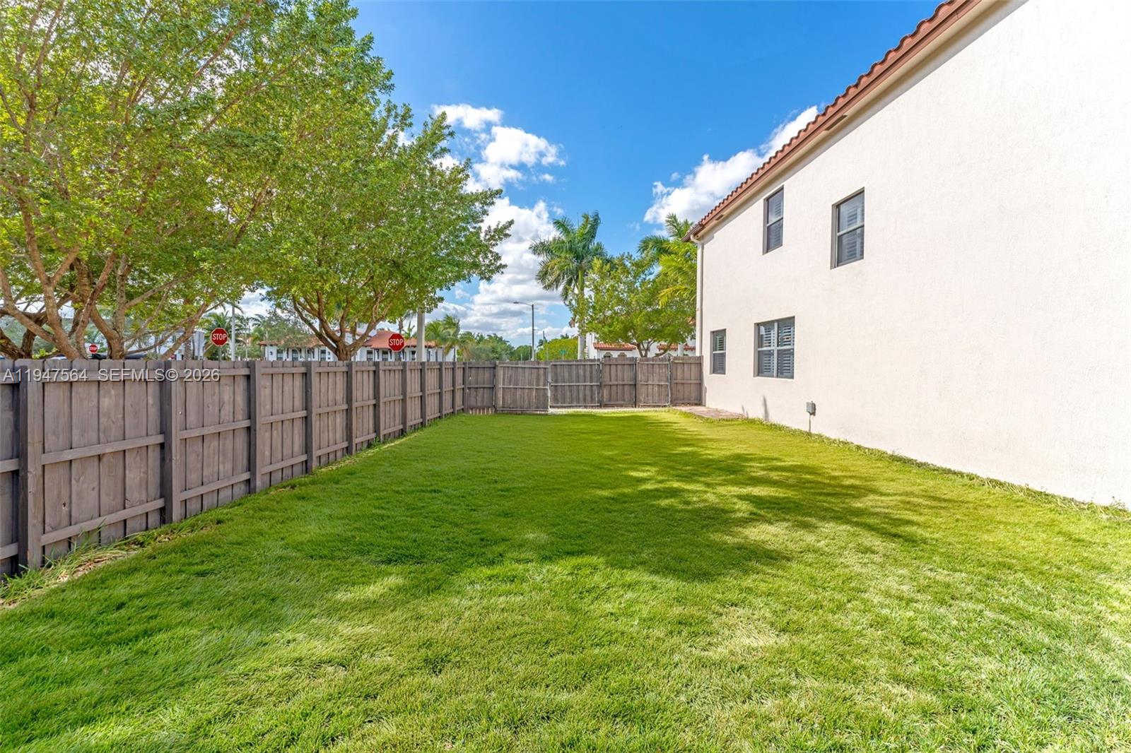 17475 Southwest 153rd Avenue Miami, FL 33187 - Photo 38 of 46 a view of backyard with garden and trees