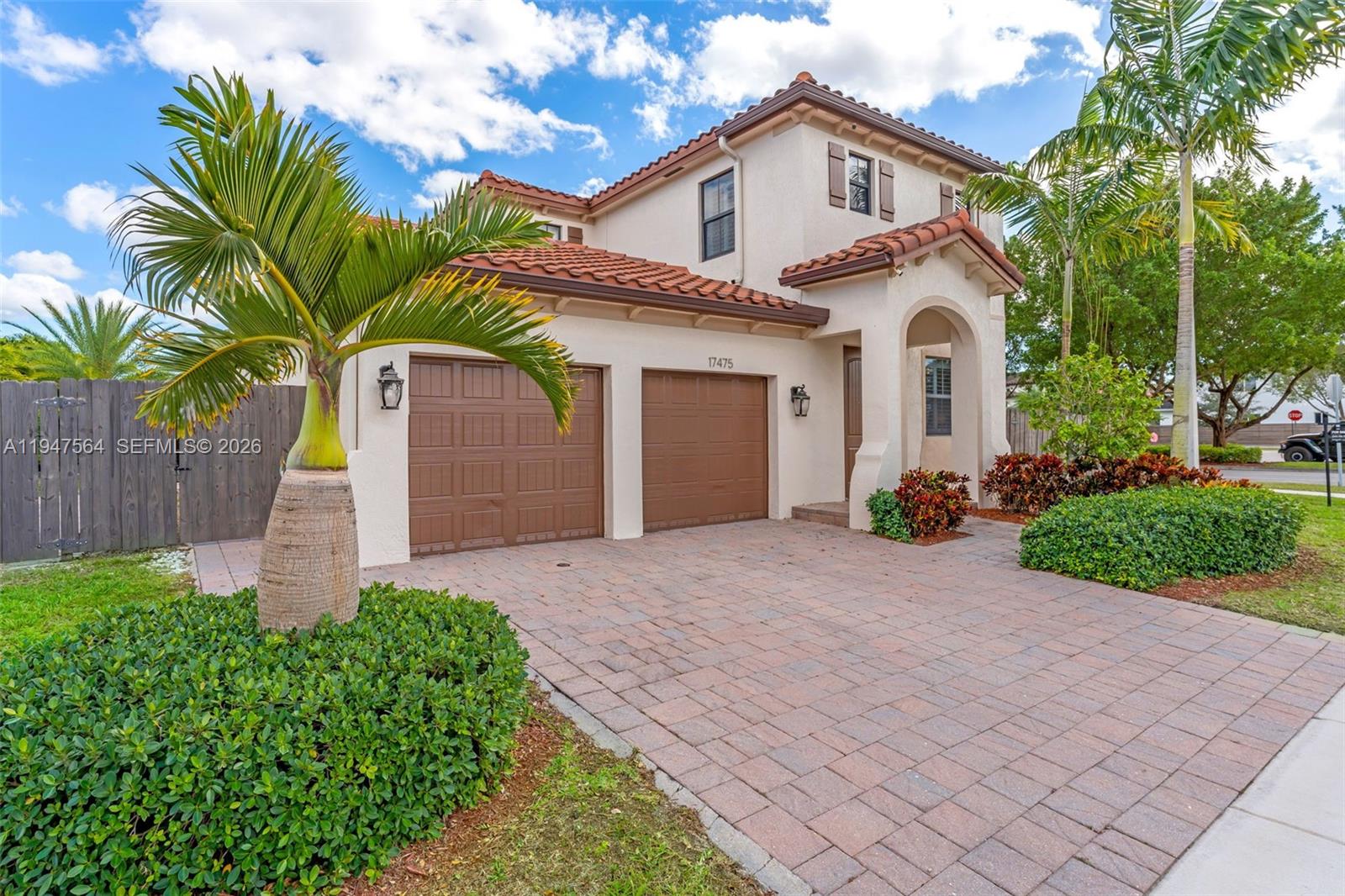 17475 Southwest 153rd Avenue Miami, FL 33187 - Photo 43 of 46 a front view of a house with garden