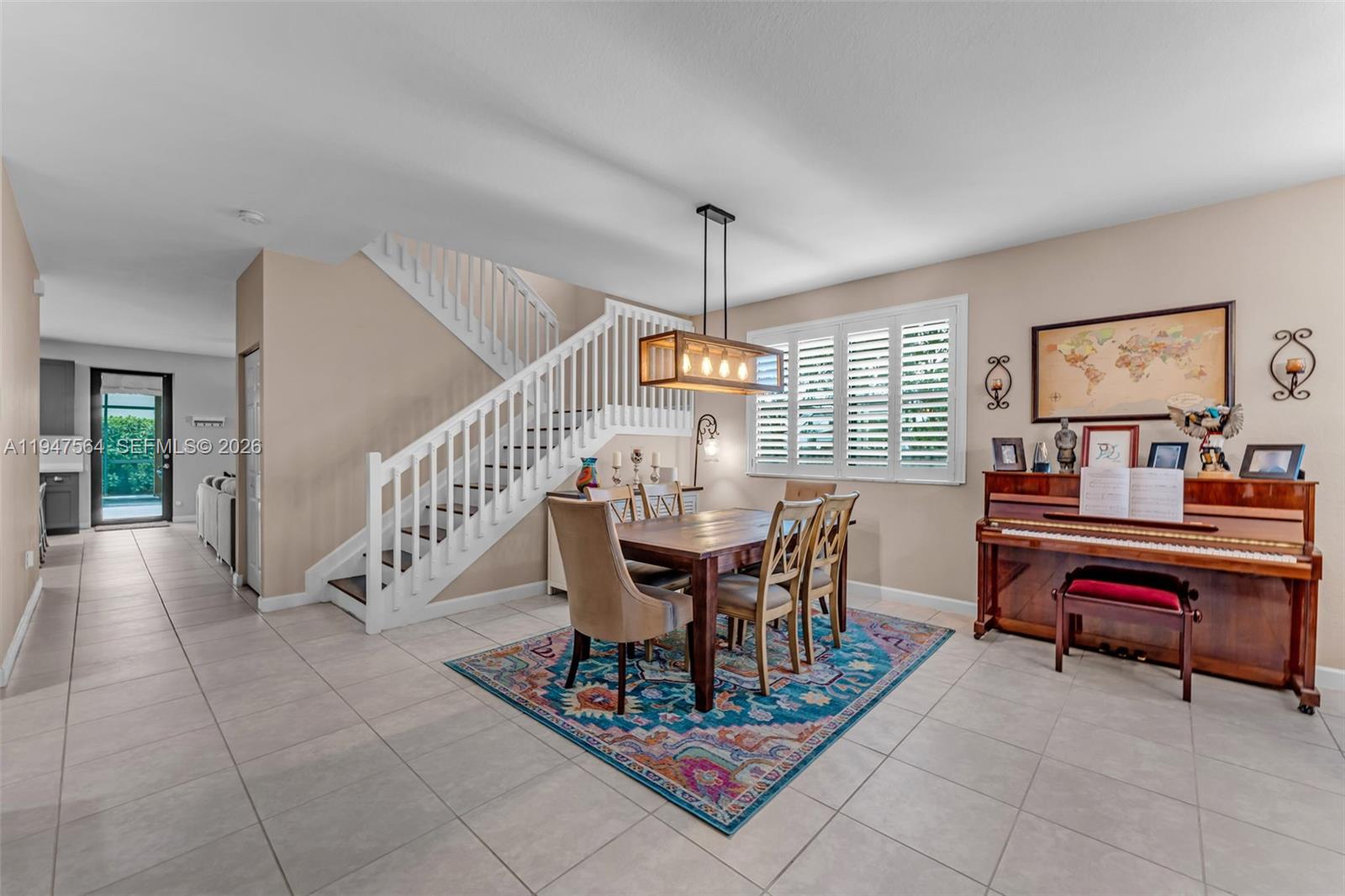 17475 Southwest 153rd Avenue Miami, FL 33187 - Photo 6 of 46 a view of a dining room with furniture window and wooden floor