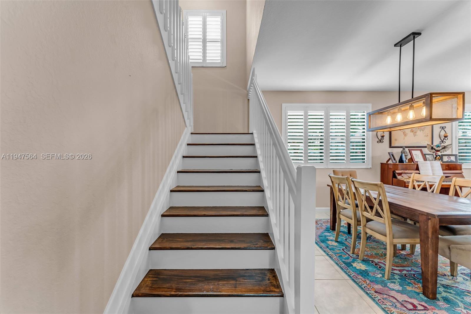 17475 Southwest 153rd Avenue Miami, FL 33187 - Photo 8 of 46 a view of entryway and hall with wooden floor