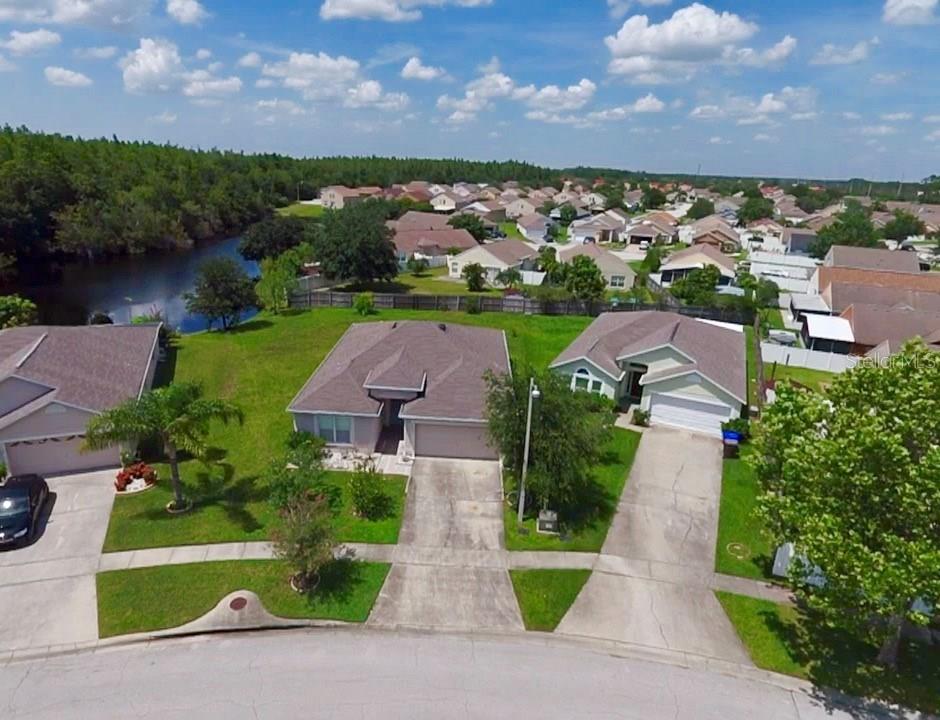 2158 Marisol Loop Kissimmee, FL 34743 - Photo 1 of 1 Aerial View of Front of House and Back