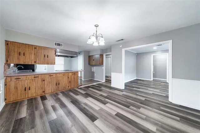 a spacious bathroom with a sink and a mirror
