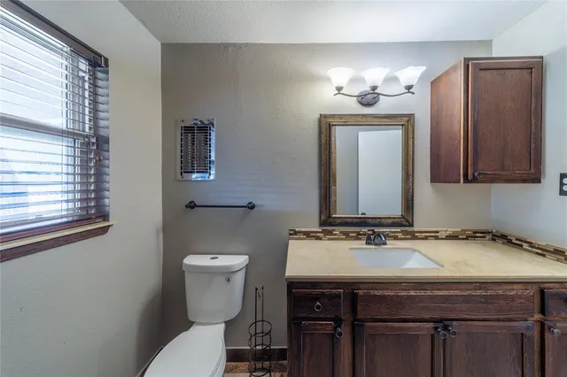 a bathroom with a sink and a toilet