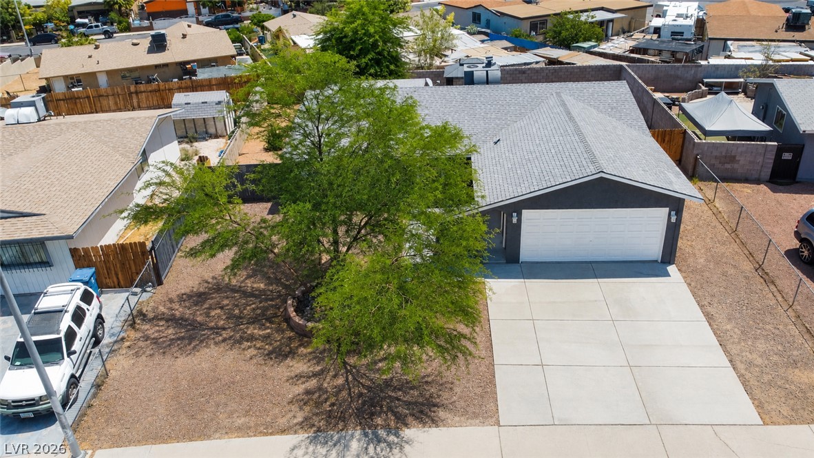 2870 South Sandhill Road Las Vegas, NV 89121 - Photo 57 of 64 A well-maintained concrete driveway leads to a pristine garage with ample curb appeal.