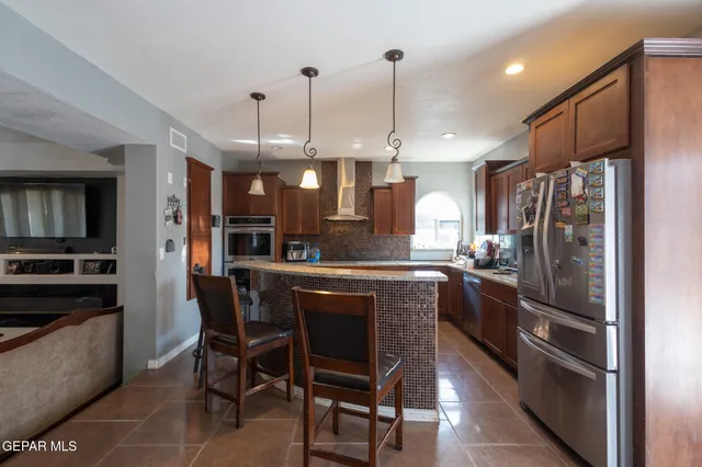 a living room with furniture a dining table and a piano table