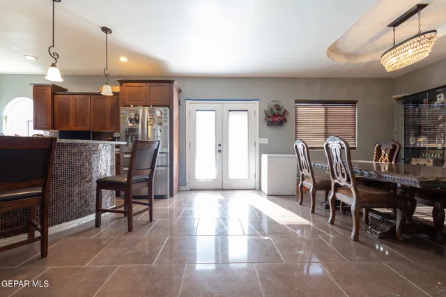 a living room with pool table and a flat screen tv