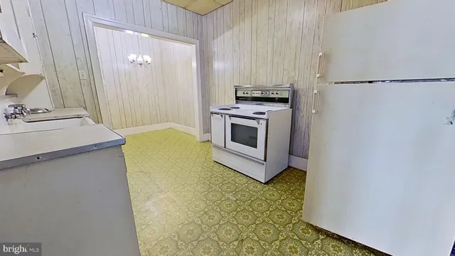 a kitchen with a sink and a stove top oven