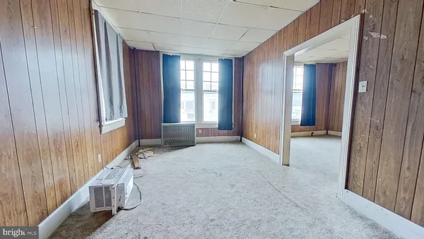 a view of a livingroom with an entryway