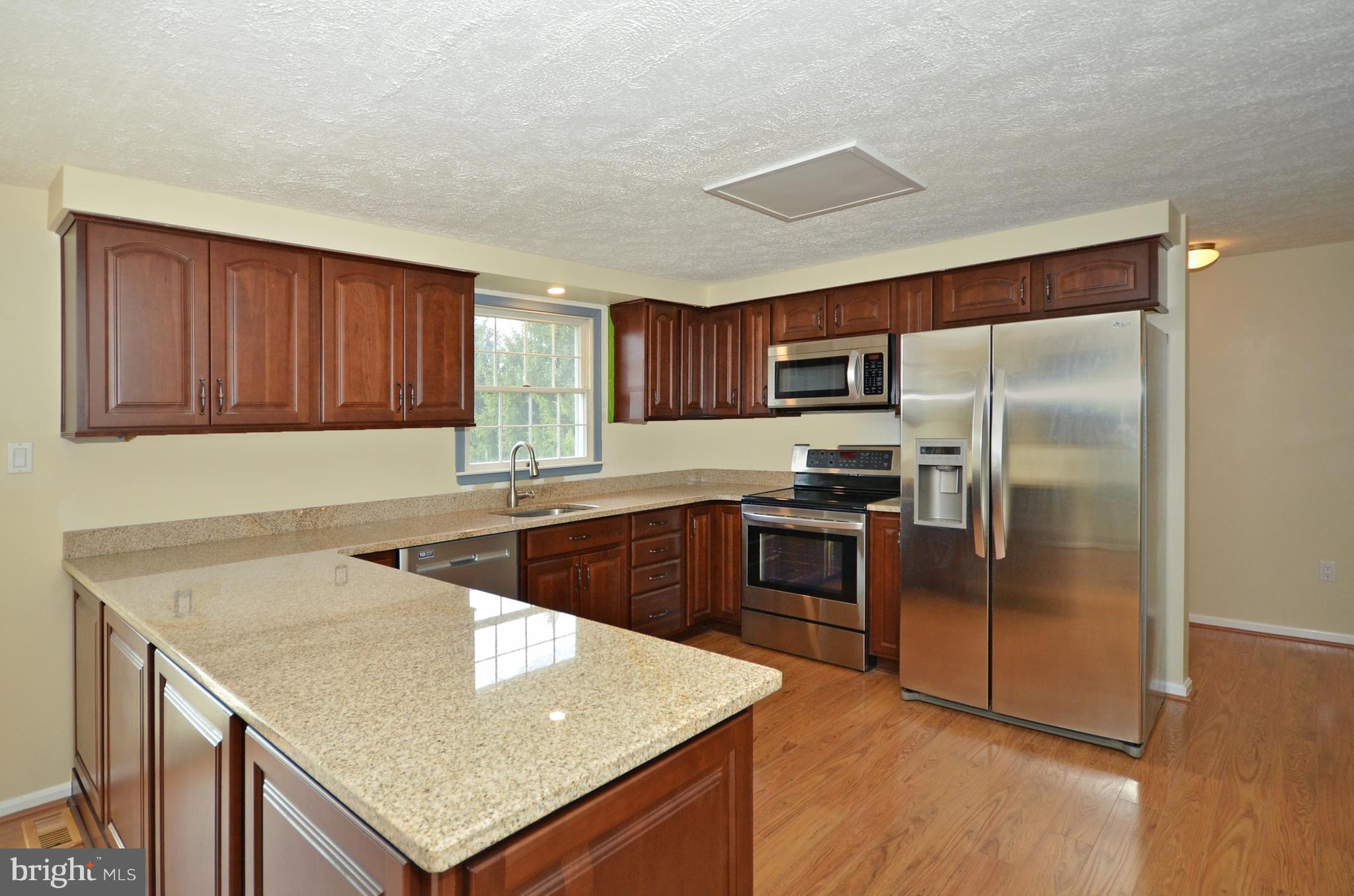 2905 Anderson Road White Hall, MD 21161 - Photo 4 of 26 Granite counters and S/S appliances & pantry