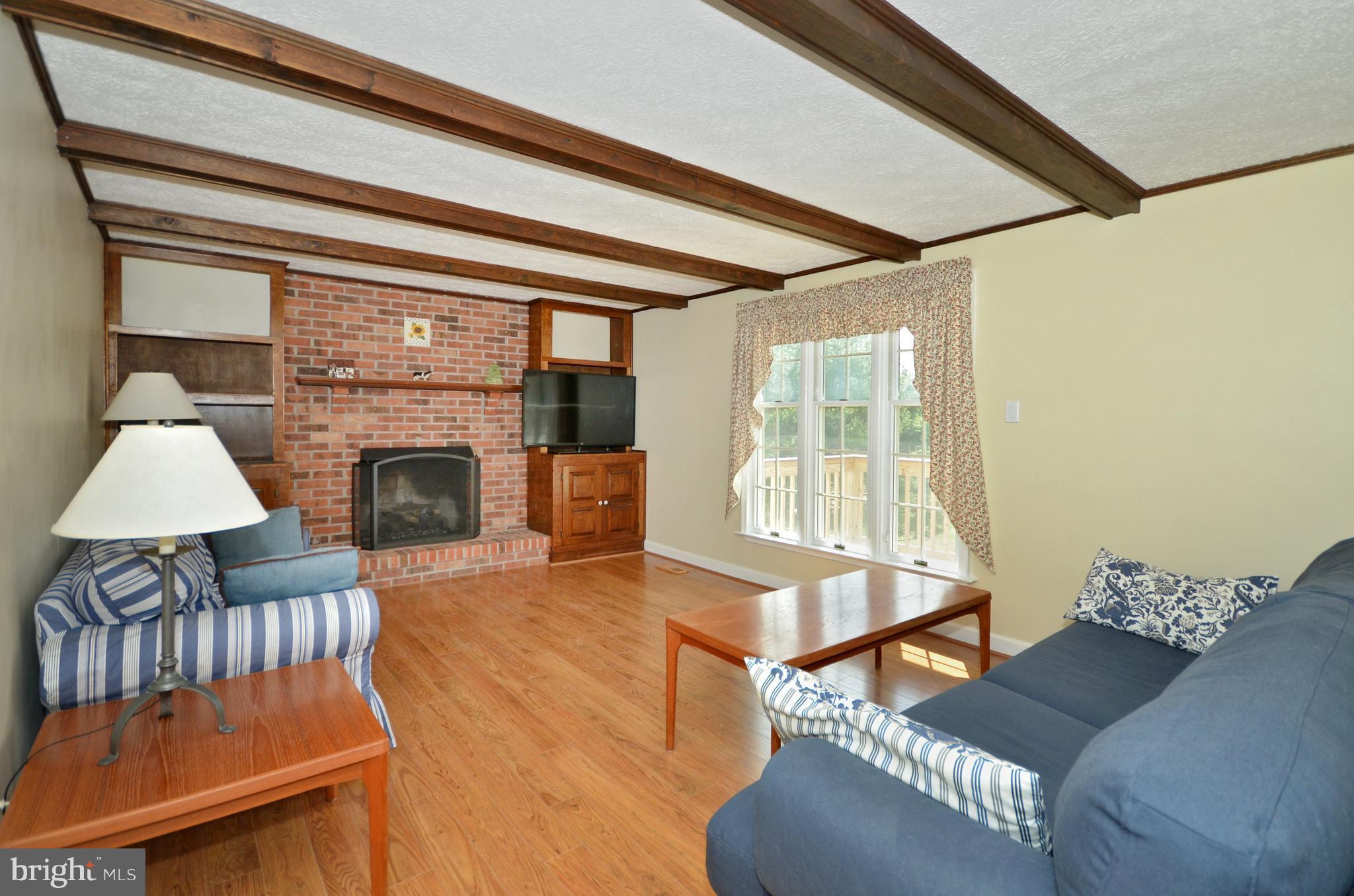 2905 Anderson Road White Hall, MD 21161 - Photo 6 of 26 Built-ins, ceiling beams and gas fireplace