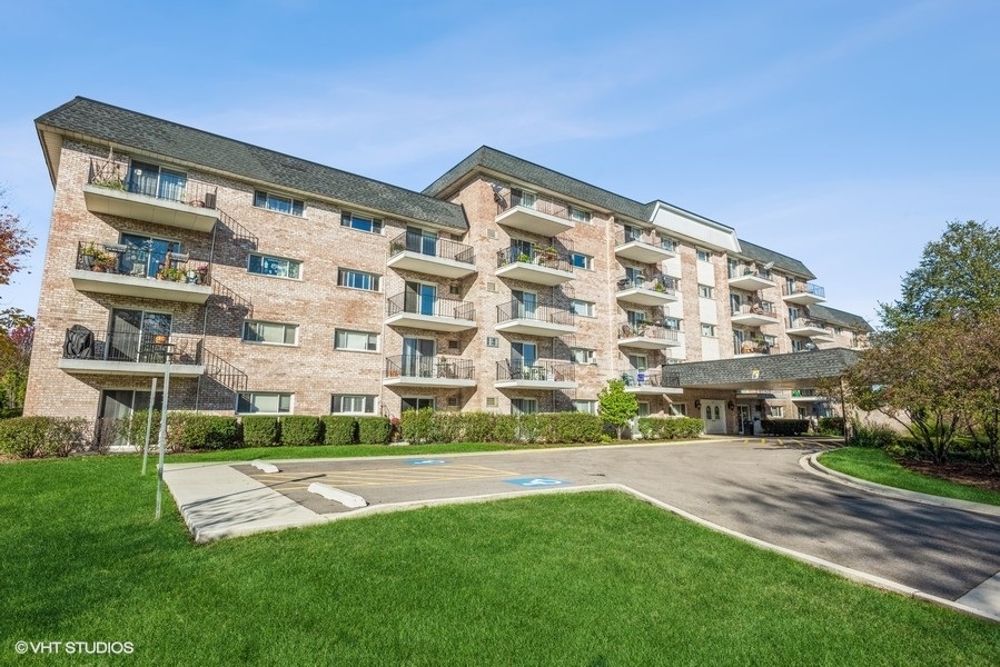 1000 South Lorraine Road, Unit 307 Wheaton, IL 60189 - Photo 1 of 10 a view of building with yard