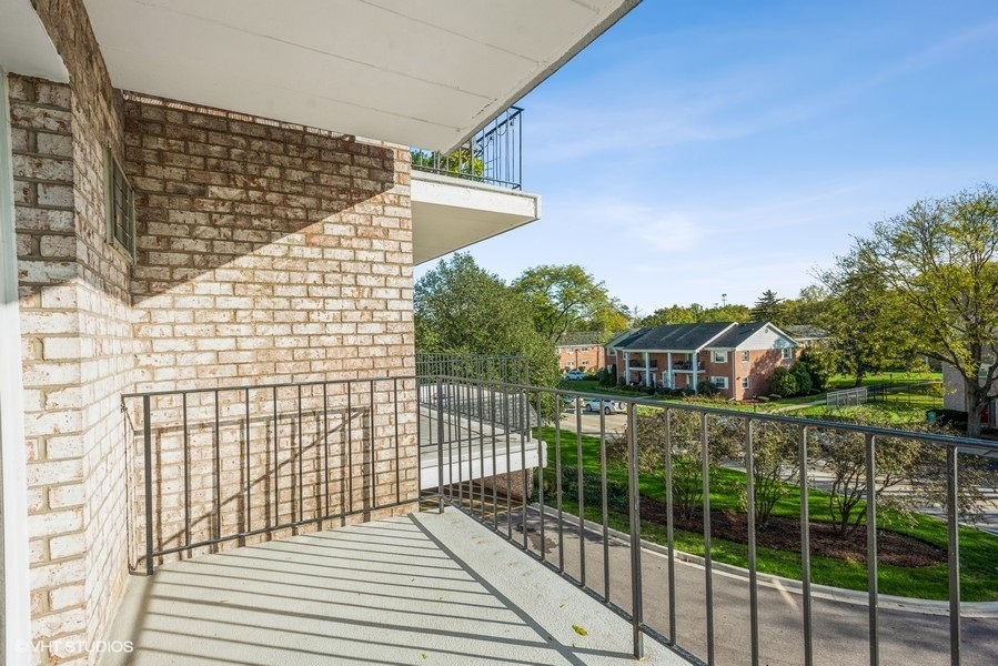 1000 South Lorraine Road, Unit 307 Wheaton, IL 60189 - Photo 10 of 10 a view of a balcony with a floor to ceiling window