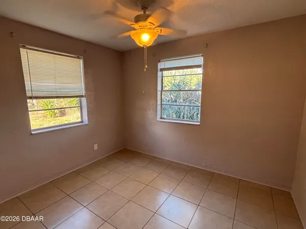 a view of entryway with a chandelier fan