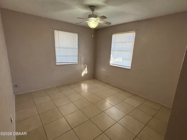 a view of a chandelier fan in a room