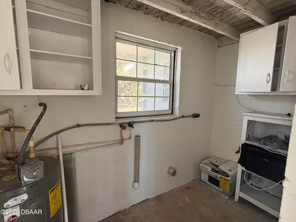 a view of an empty room with a window