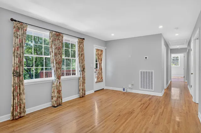 a view of room with wooden floor
