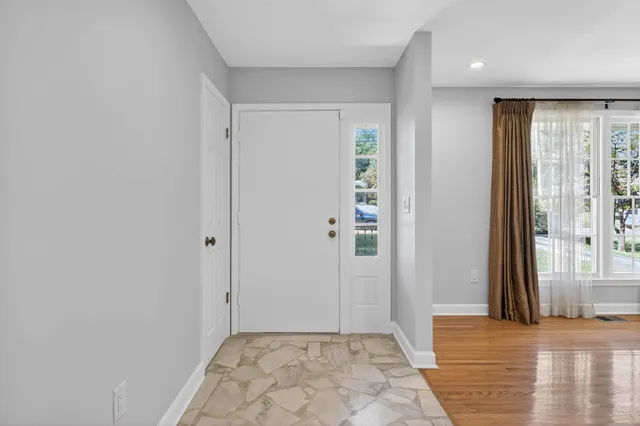 a view of a hallway with a room