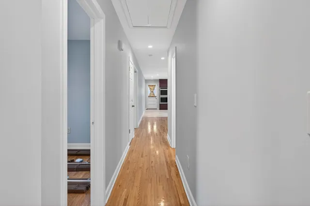 a balcony with table and chairs