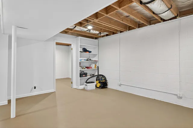 a backyard of a house with plants and garden