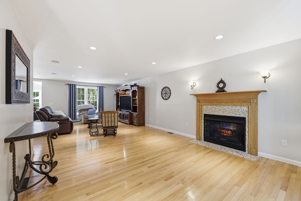 345 Bragg Road Warren, MA 01585 - Photo 7 of 41 a living room with furniture and a fireplace