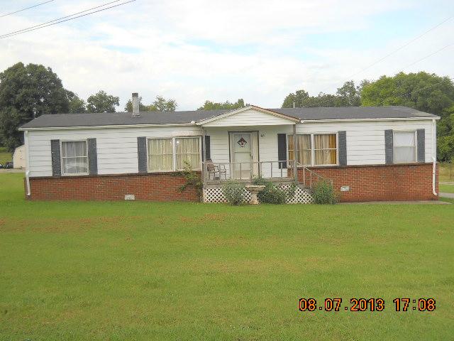 405 Thomas Road Lebanon, TN 37087 - Photo 1 of 12 a front view of a house with a garden