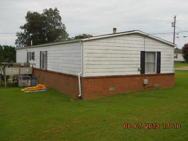 405 Thomas Road Lebanon, TN 37087 - Photo 11 of 12 a backyard of a house with table and chairs