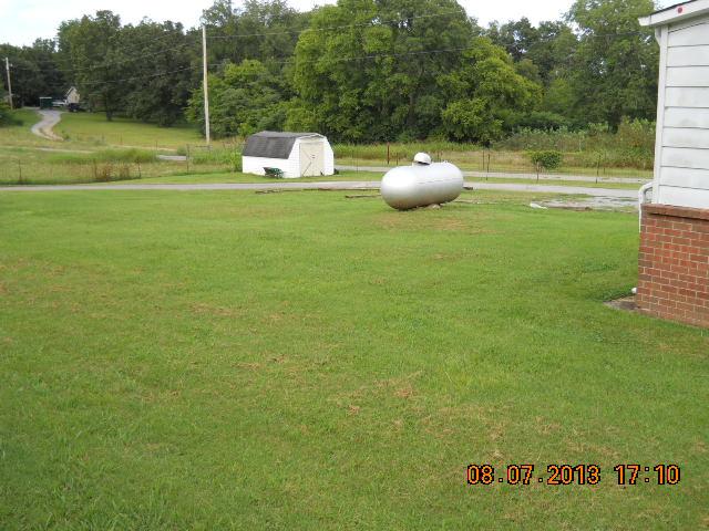 405 Thomas Road Lebanon, TN 37087 - Photo 12 of 12 a view of a golf course with a lake