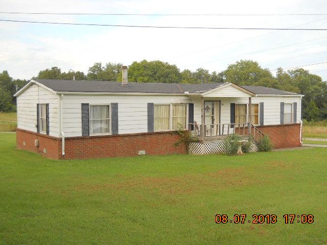 405 Thomas Road Lebanon, TN 37087 - Photo 3 of 12 a view of a house with pool and a yard