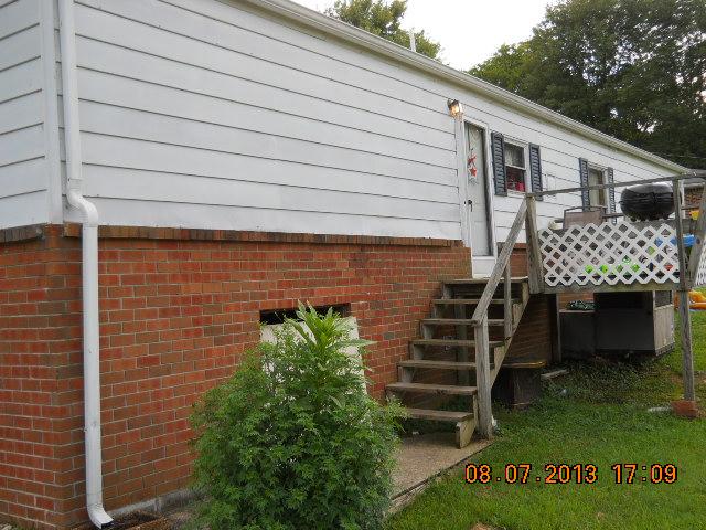 405 Thomas Road Lebanon, TN 37087 - Photo 6 of 12 a front view of a house with a garden