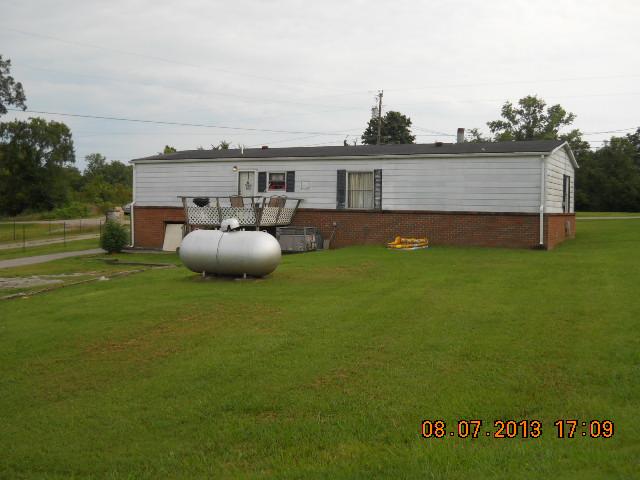 405 Thomas Road Lebanon, TN 37087 - Photo 9 of 12 a view of a backyard with table and chairs