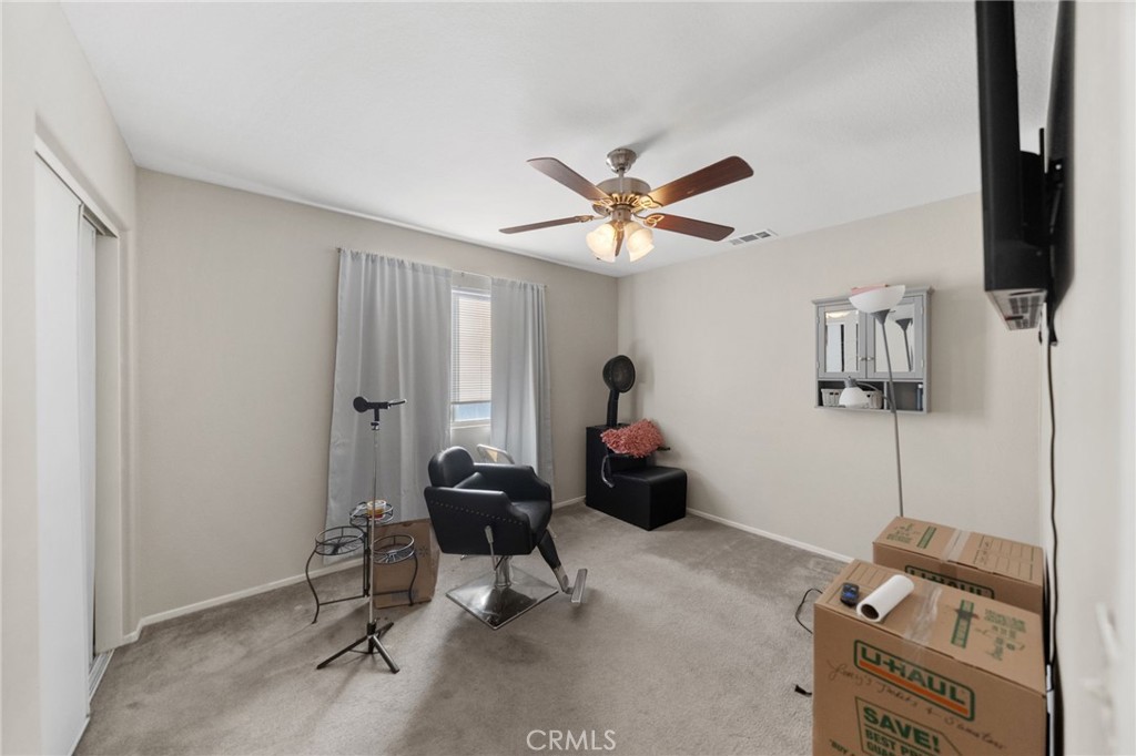 1494 Rabbit Peak Way Hemet, CA 92545 - Photo 30 of 45 a livingroom with furniture and a flat screen tv
