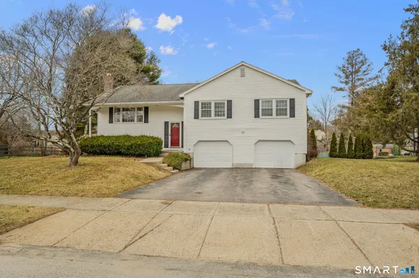 a view of front of house with a yard