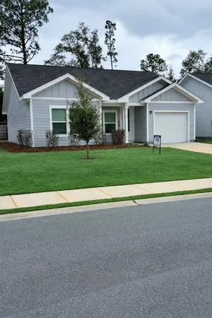 front view of a house and a yard