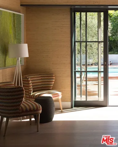 a view of a chair and fire pit in an empty room