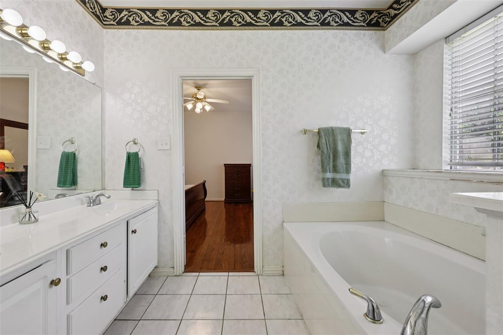 3004 Springfellow Drive Plano, TX 75025 - Photo 20 of 37 a spacious bathroom with a tub sink and mirror