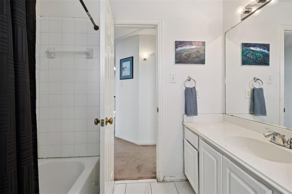 3004 Springfellow Drive Plano, TX 75025 - Photo 26 of 37 a bathroom with double vanity sink and a mirror