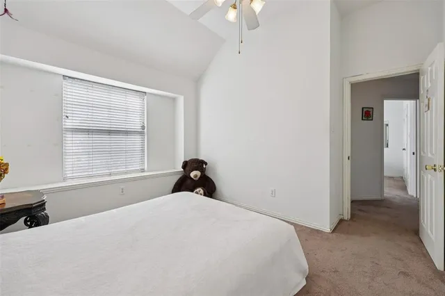 a bed room with a bed and a window