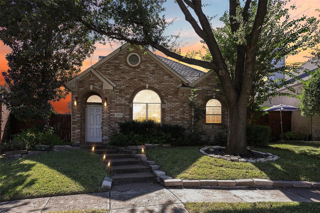 3004 Springfellow Drive Plano, TX 75025 - Photo 35 of 37 a front view of a house with garden