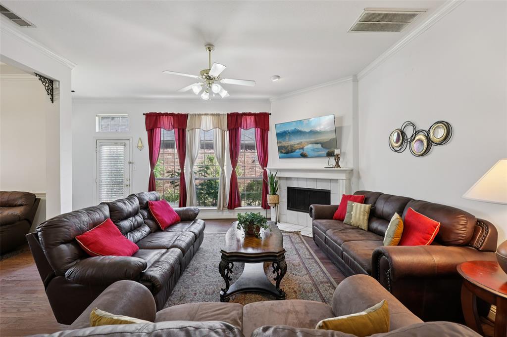 3004 Springfellow Drive Plano, TX 75025 - Photo 8 of 37 a living room with furniture fireplace and window