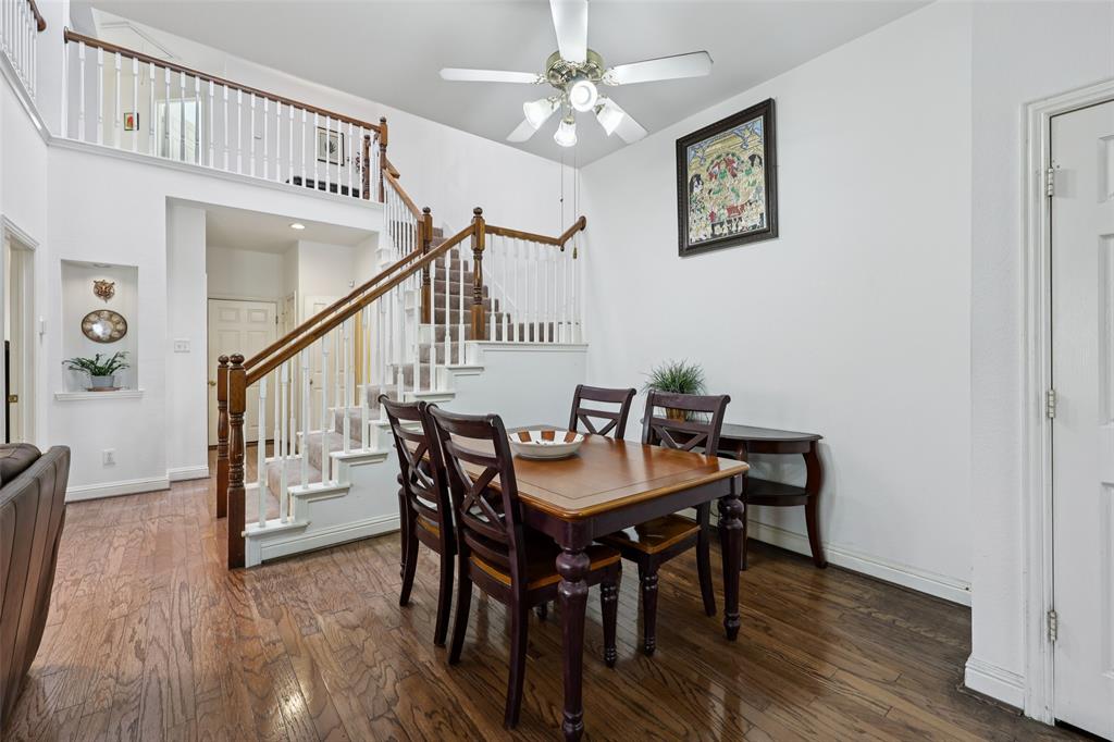 3004 Springfellow Drive Plano, TX 75025 - Photo 10 of 37 a view of a dining room with furniture and wooden floor