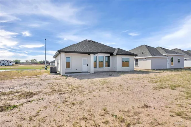 a big house with a big yard and large trees
