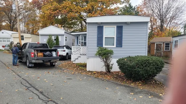 a view of a car in front of a house